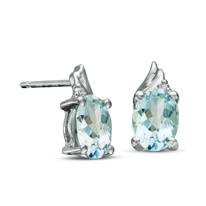 Goldia Earrings Oval Aquamarine and Diamond Accent Swirl Top Drop Earrings in 10K White Gold Goldia Earrings Oval Aquamarine and Diamond Accent Swirl Top Drop Earrings in 10K White Gold