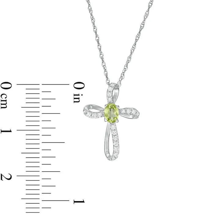 Oval Peridot and 01 CT TW Natural Diamond Pinwheel Cross Pendant in 10K White Gold Goldia Necklaces Oval Peridot and 01 CT TW Natural Diamond Pinwheel Cross Pendant in 10K White Gold Goldia Necklaces